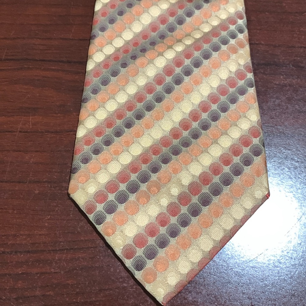 Geoffrey Beene Necktie, 100% silk, tan/brown/red/orange circle/stripe pattern